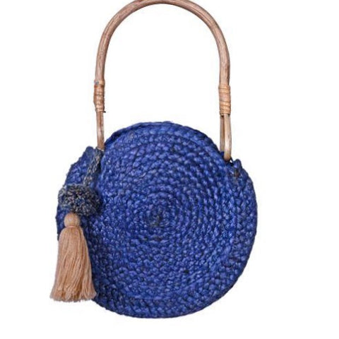 Set off for a day in the sun or in town with this tassel detail jute tote. - Wooden top handle - Open top - Exterior features tassel 