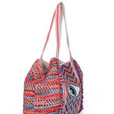 et off for a day in the sun with this beautiful weaved bag.  The Beaded Eye and the fun Tassel details make it a Eye Catcher.....