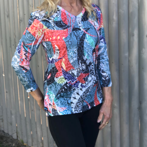 Light 3/4 Sleeve High Low Cut Black and Coral T-Shirt Very light and comfortable bright t-shirt with a high low and a round neck cut with a slit on each side for added comfort.  Polyester/Rayon Blend  Machine Wash Cold by Two B's Accessories
