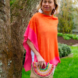 Two tone Poncho by Whimsy Rose.This colorful poncho dresses up any outfit in summer. The two tone add an extra detail.  Easily fold in a bag or luggage for convenience and doesn't wrinkle.